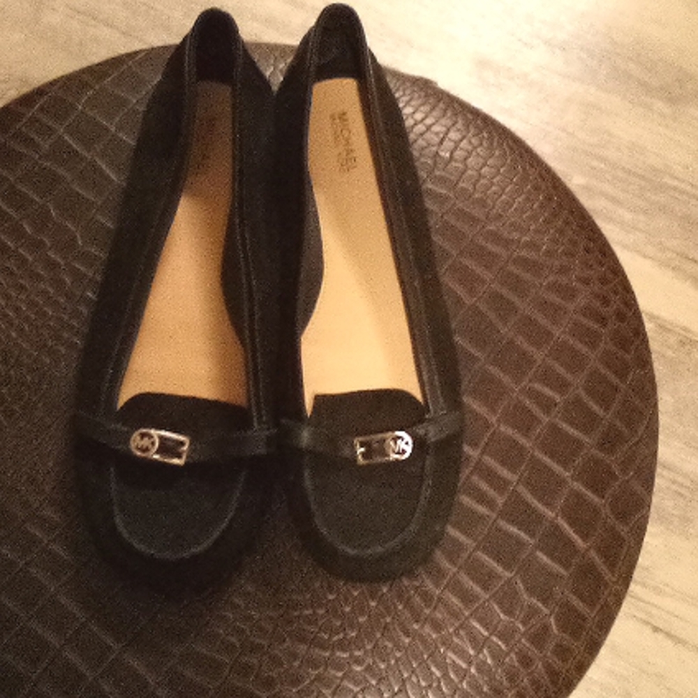 Used Michael Kors black flats with small logo on buckle.
